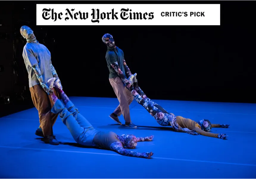 four dancers in floral outfits, two holding the others by their feet. New York Times logo at top.