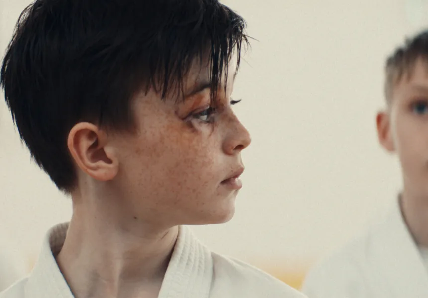 YELLOW BELT image, young boy in karate class with black eye