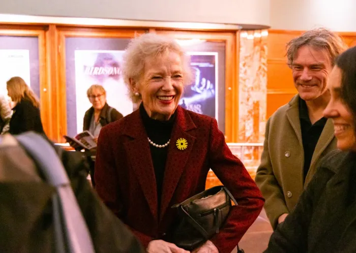 Mary Robinson smiling in AFI lobby with theatre-goers